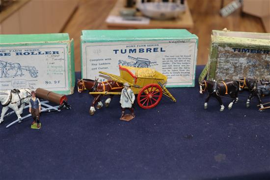 A collection of pre-war Britains Home Farm series models including a boxed farm wagon, boxed timber carriage, boxed tumbrel horse